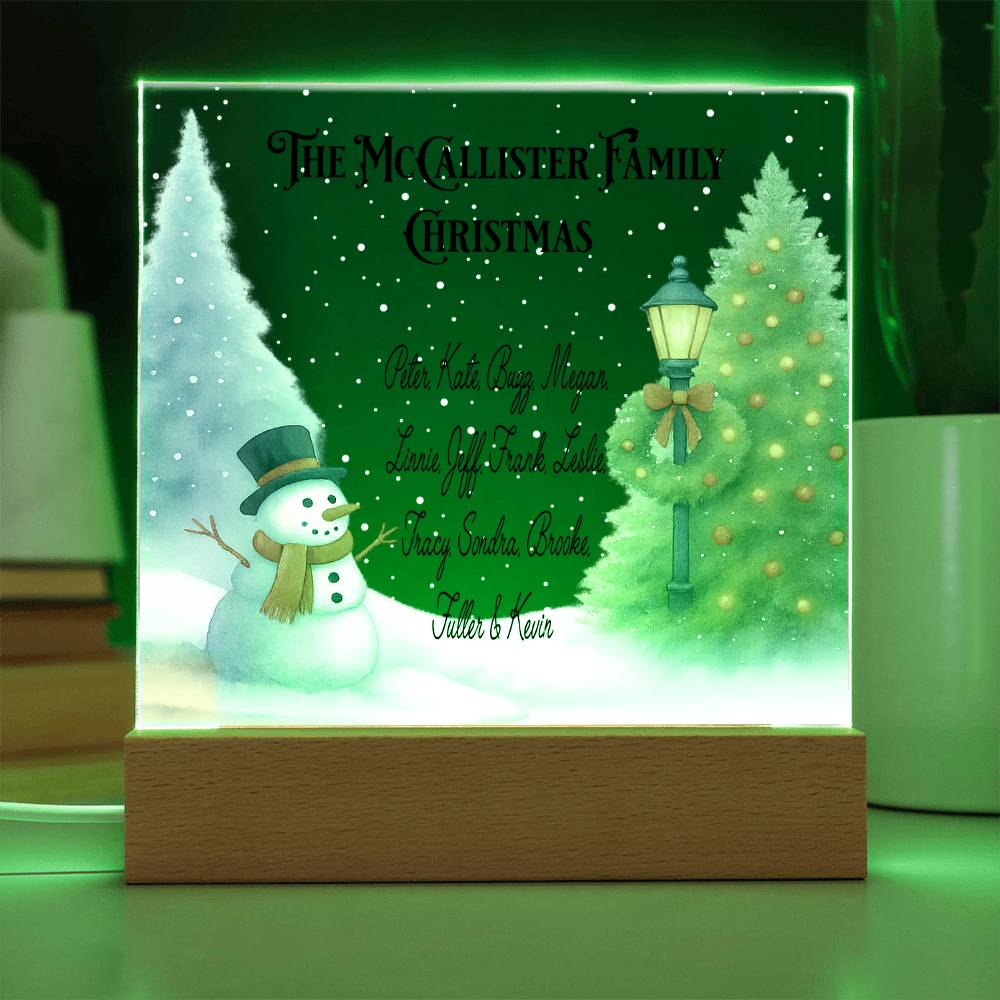 Decorative Christmas-themed light box with a snowman and tree design, featuring the McCallister Family Christmas text.