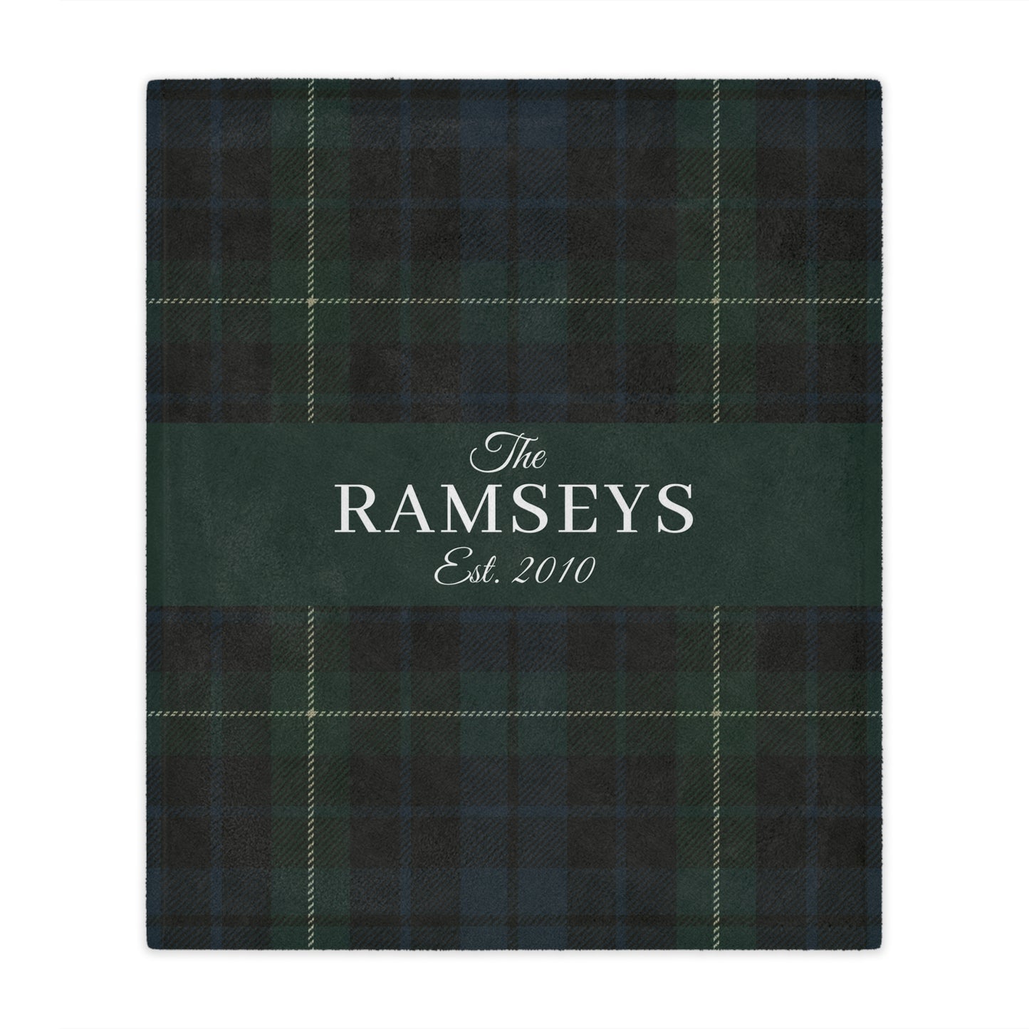 Green plaid blanket with 'The Ramseys Est. 2010' text