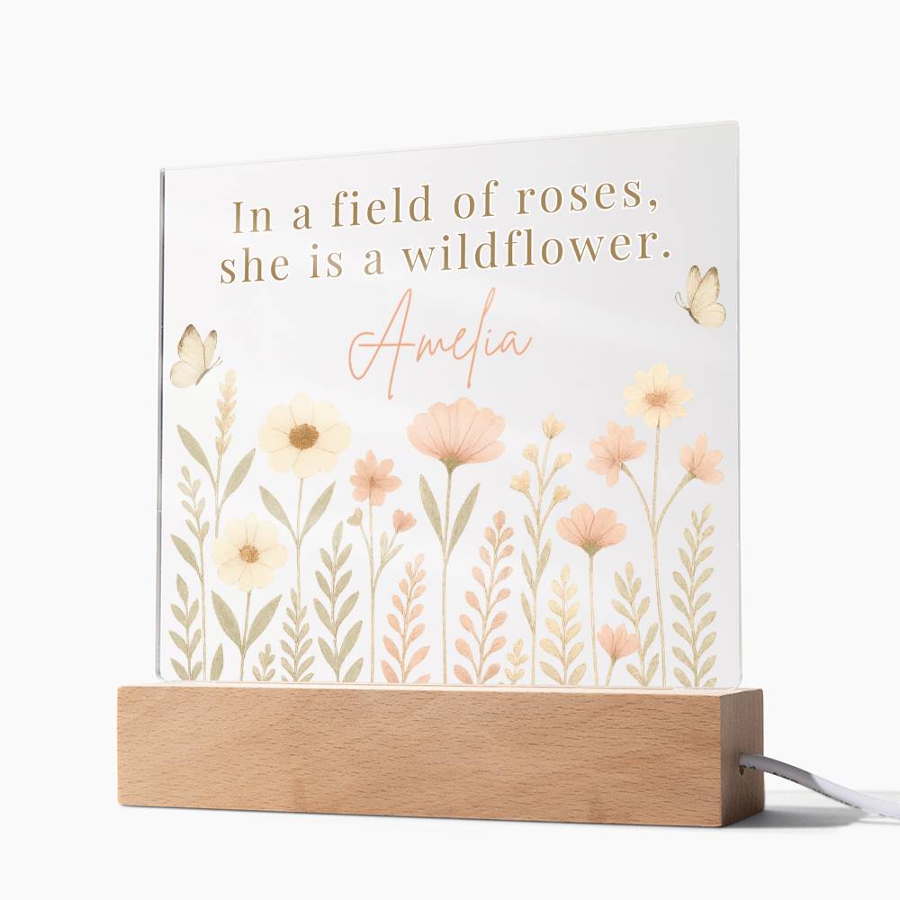 Decorative lamp with floral design and text on a white background