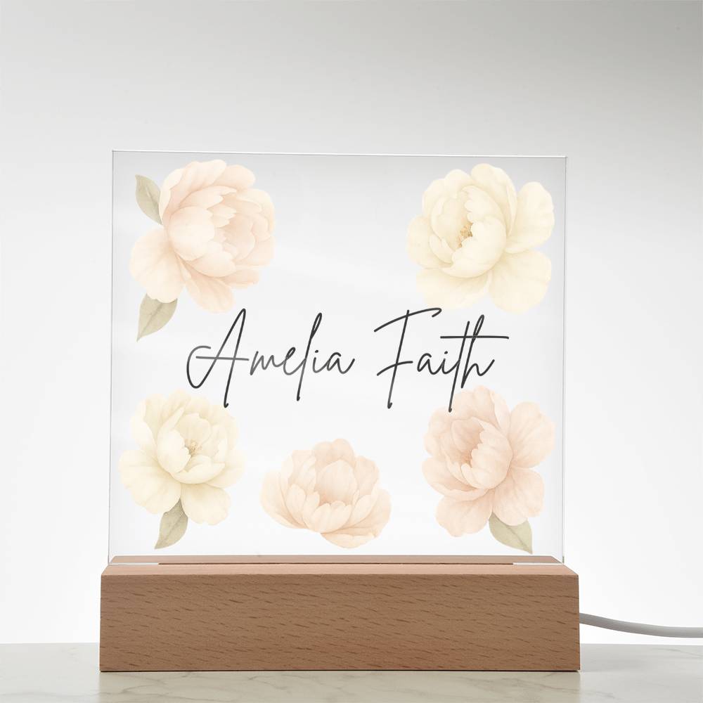Decorative lamp with floral peony design and personalized text on a light background