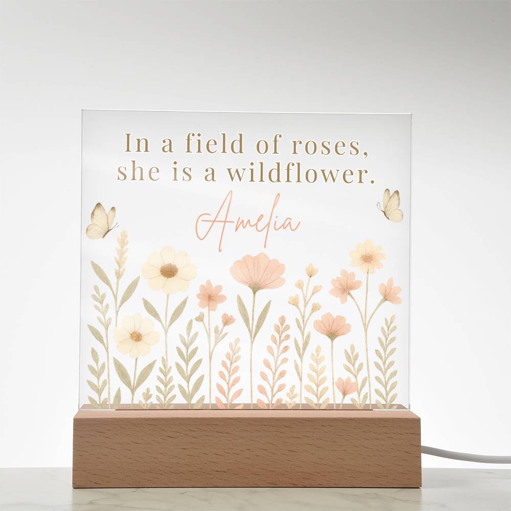 Decorative lamp with floral design and text on a white background