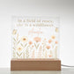Decorative lamp with floral design and text on a white background